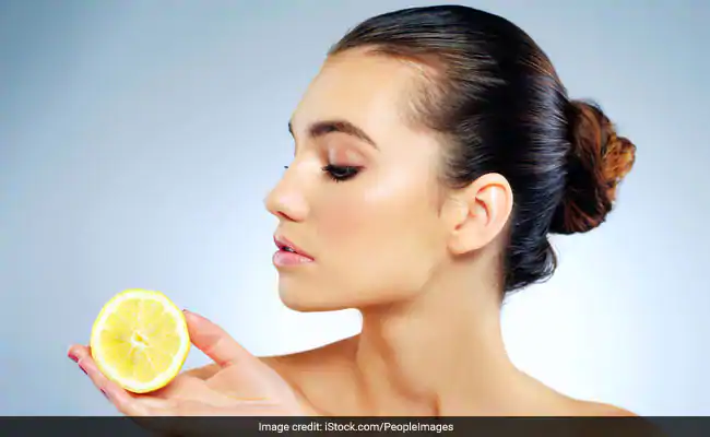 How to apply lemon on face.